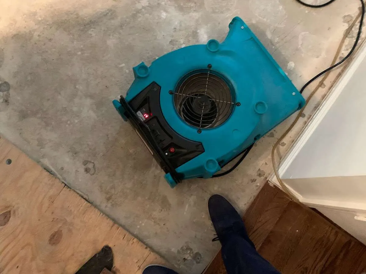 Air mover drying subfloor during Commercial Water Damage Restoration in Sunrise